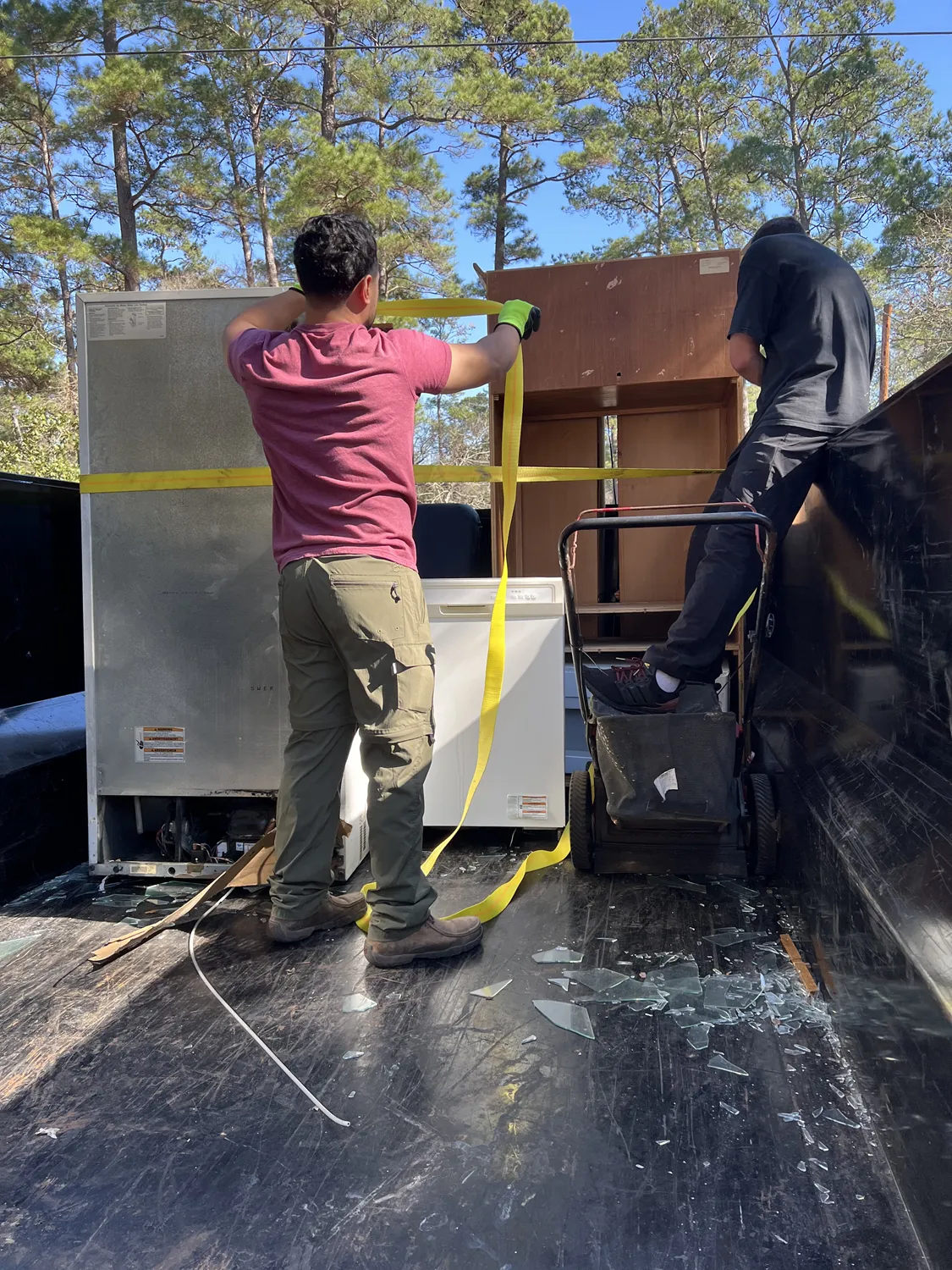 Clearout Junk crew removing a refrigerator from a Conroe, TX home