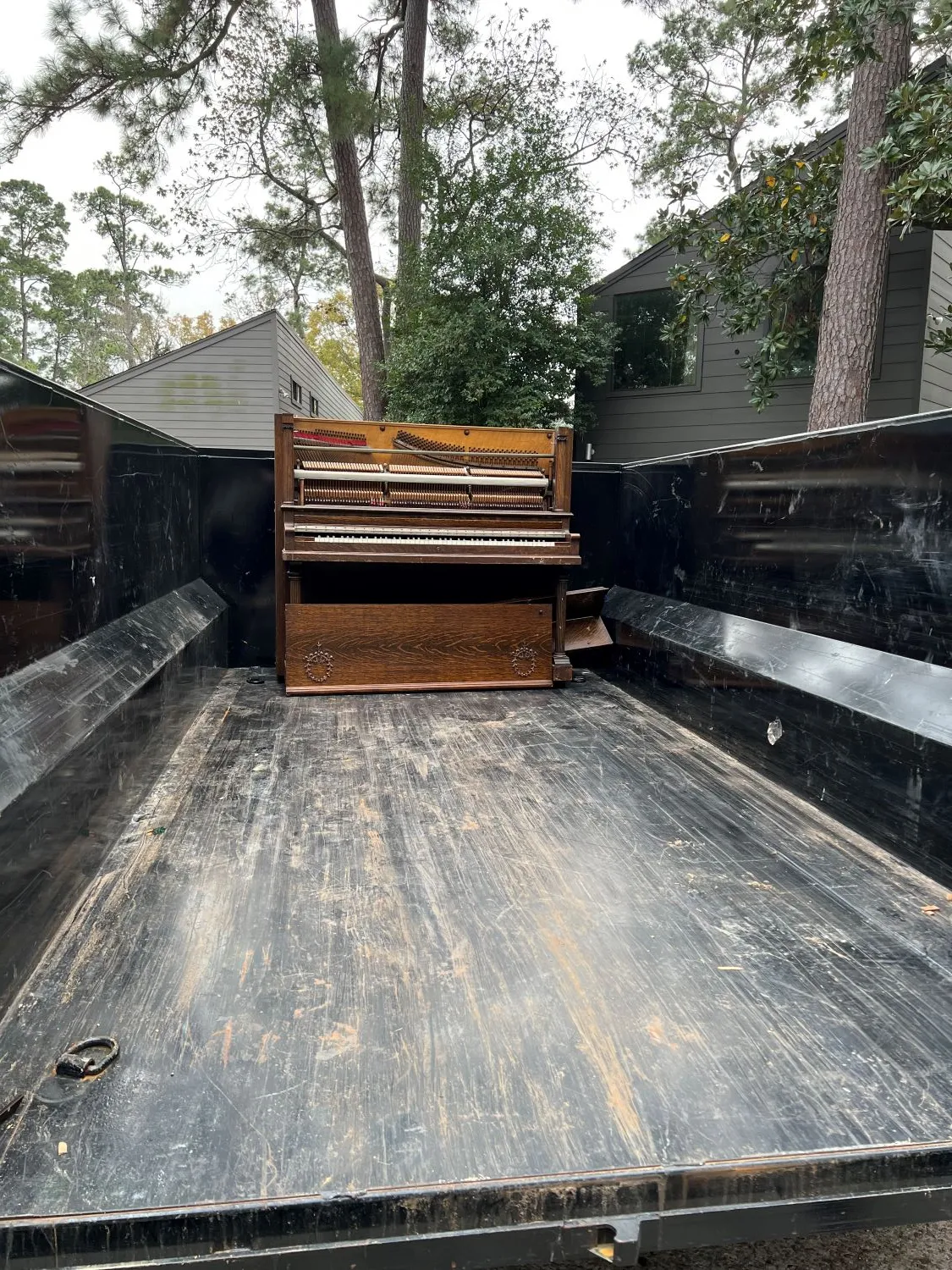 Piano and office furniture loaded for removal by Clearout Junk in Kingwood TX