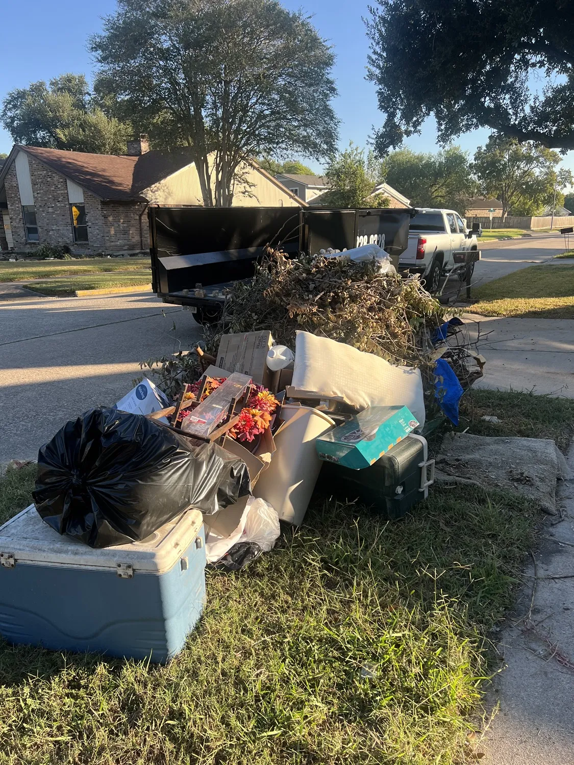 Curbside junk pile before pickup by Clearout Junk in Houston TX